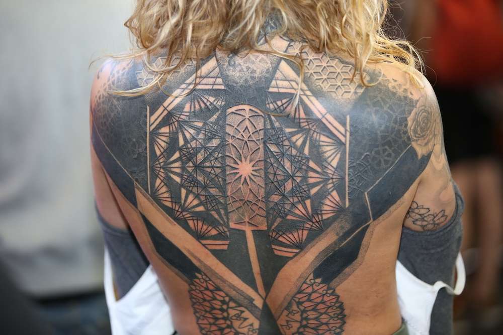 9. "Chic Geometric Back Tattoo" - wide 4