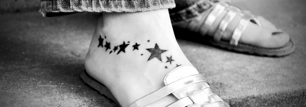 Thinking about getting a foot tattoo like this one of stars? Looks good with sandals!