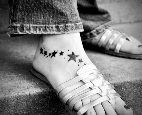 Thinking about getting a foot tattoo like this one of stars? Looks good with sandals!