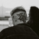 An intricate head tattoo on the back of a man's head.