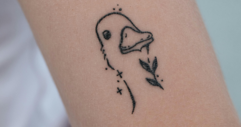 Fine-line tattoos are soft and delicate and cute like this duck.