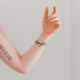 Should you get a tattoo based off your personality? This arm with delicate tattoos is a good example of how your personality can inspire your ink.