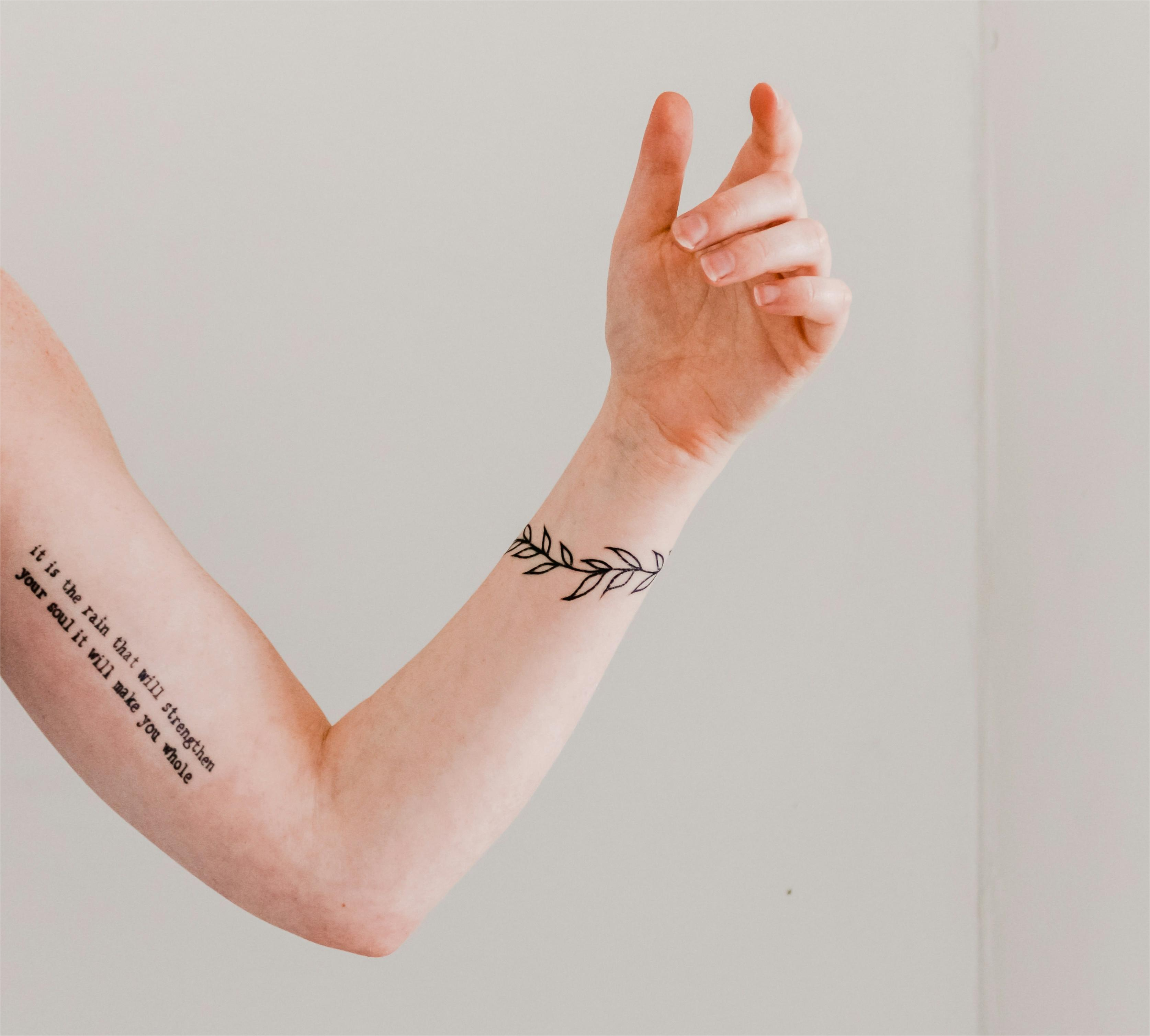 Should you get a tattoo based off your personality? This arm with delicate tattoos is a good example of how your personality can inspire your ink.